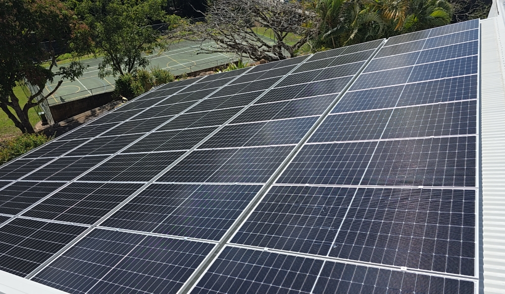 Technician installing solar energy equipment